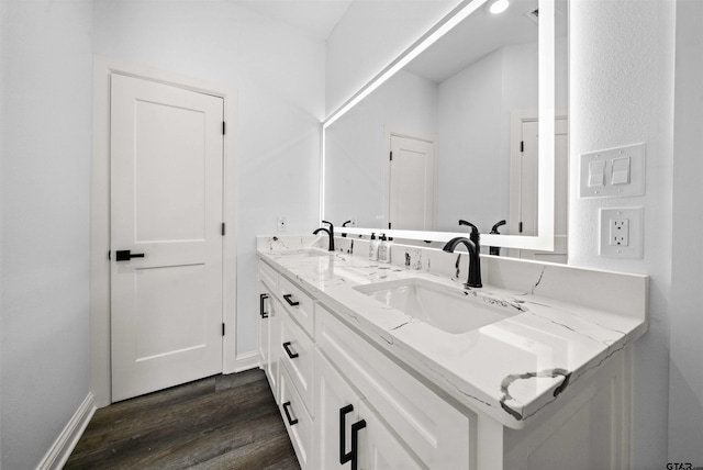 bathroom with vanity and hardwood / wood-style floors