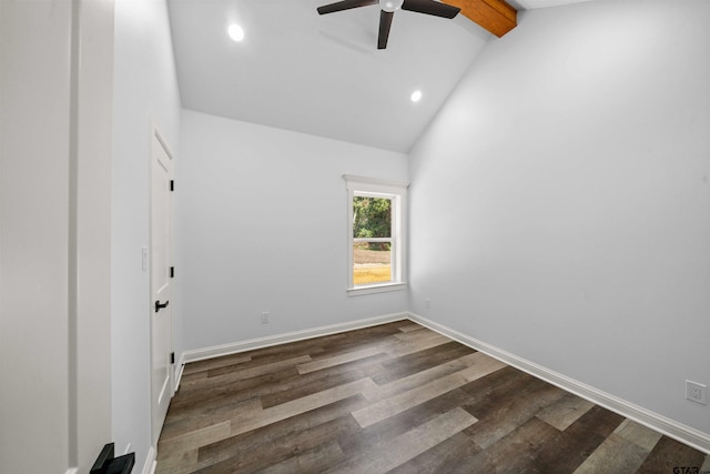 spare room featuring lofted ceiling with beams, dark hardwood / wood-style floors, and ceiling fan