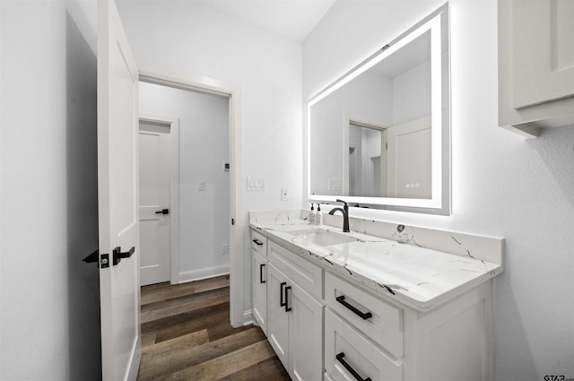 bathroom featuring vanity and wood-type flooring