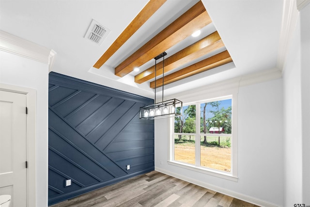 unfurnished dining area featuring wood-type flooring