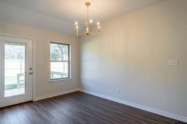 interior space featuring a chandelier, dark hardwood / wood-style floors, and plenty of natural light