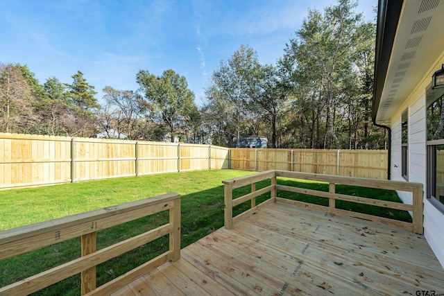 wooden deck with a lawn