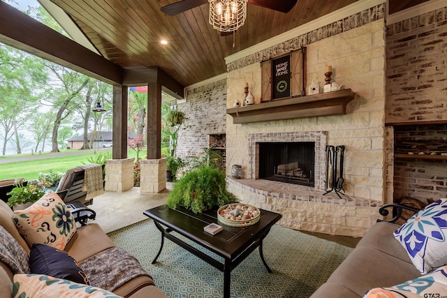 living room featuring exterior fireplace, a ceiling fan, wood ceiling, and lofted ceiling