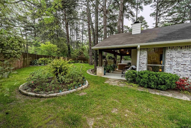 view of yard with a fenced backyard and a patio