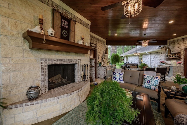 living room with an outdoor fireplace, wood ceiling, recessed lighting, and a ceiling fan