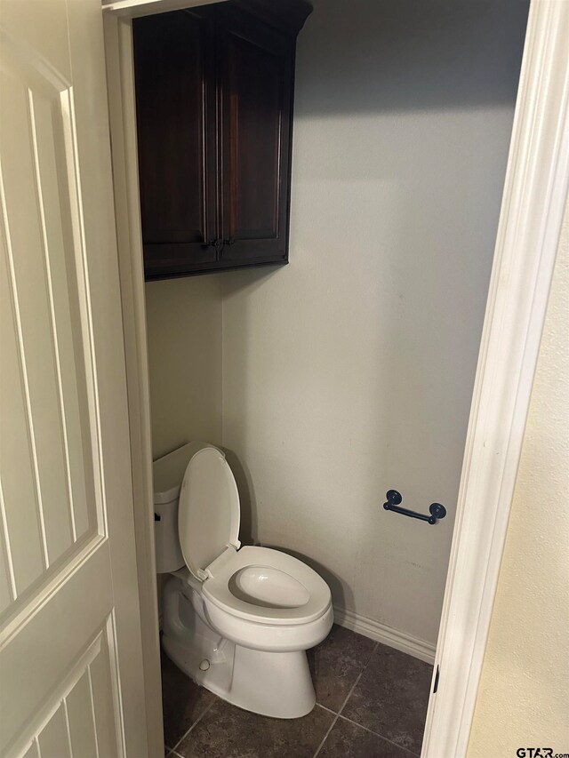 bathroom with tile patterned floors and toilet