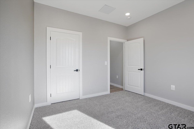 unfurnished bedroom with carpet floors