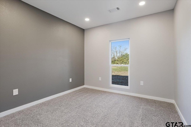 unfurnished room featuring carpet