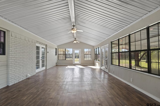 unfurnished sunroom with ceiling fan, lofted ceiling, and french doors