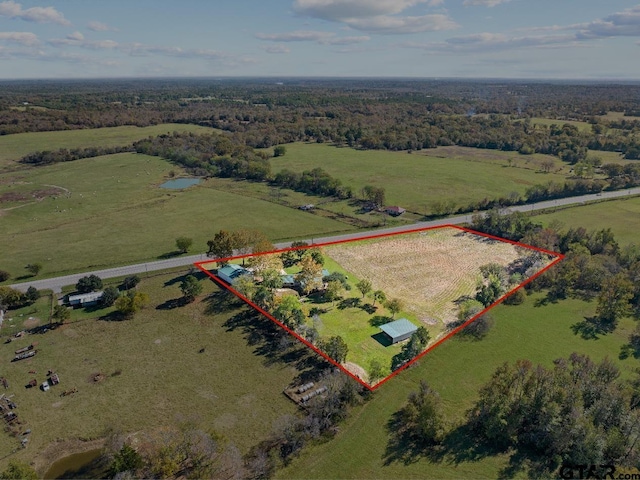 birds eye view of property featuring a rural view