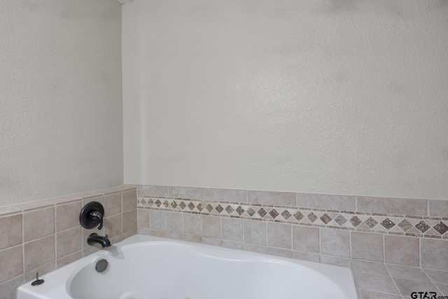 bathroom with tiled tub