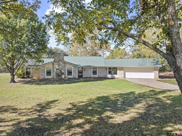 single story home featuring a garage and a front yard