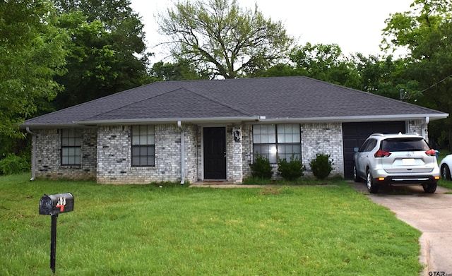 508 Baber St, Winnsboro, TX 75494 - single story home featuring an attached garage, a front yard, a shingled roof, and concrete driveway