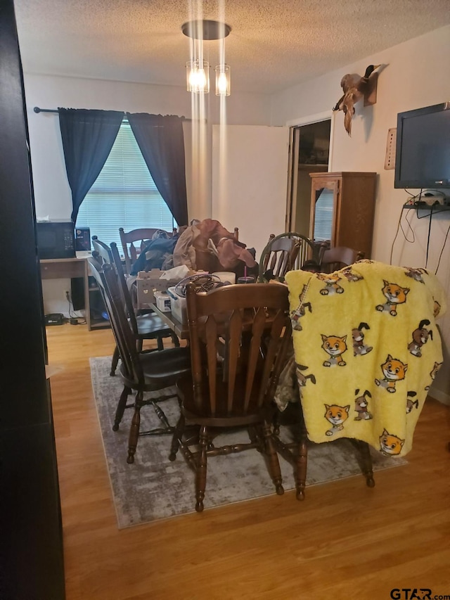 508 Baber St, Winnsboro, TX 75494 - dining room with a textured ceiling and wood finished floors