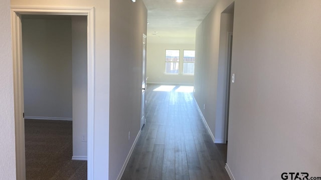 hall with dark hardwood / wood-style flooring