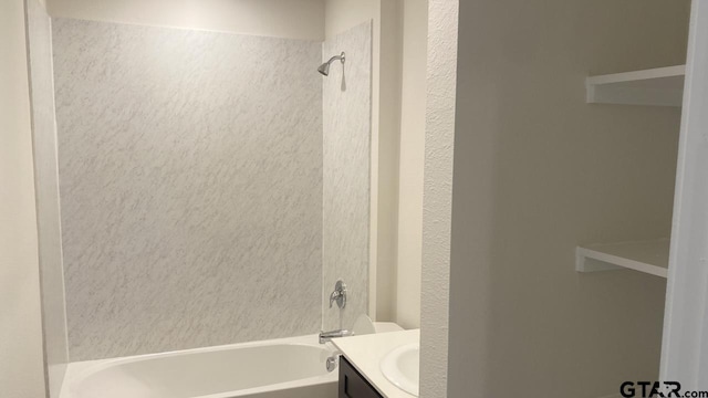 bathroom with vanity and tiled shower / bath combo