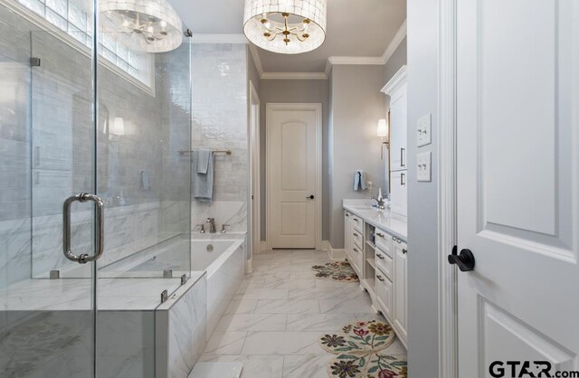 7417 Princedale, Tyler, TX 75703 - full bath with marble finish flooring, double vanity, ornamental molding, a garden tub, and a chandelier