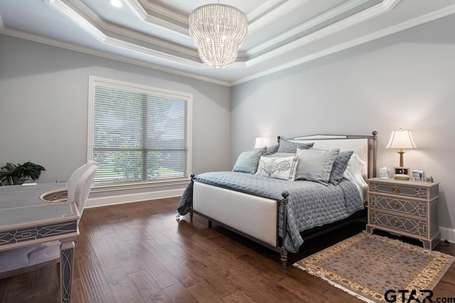 7417 Princedale, Tyler, TX 75703 - bedroom with a chandelier, ornamental molding, a tray ceiling, and wood finished floors
