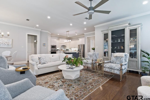 7417 Princedale, Tyler, TX 75703 - living room with a chandelier, recessed lighting, dark wood-style flooring, a ceiling fan, and crown molding