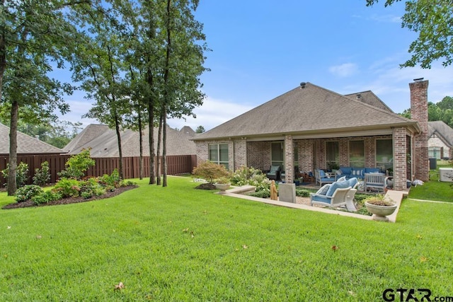 7417 Princedale, Tyler, TX 75703 - rear view of property featuring a patio, brick siding, a chimney, roof with shingles, and an outdoor hangout area