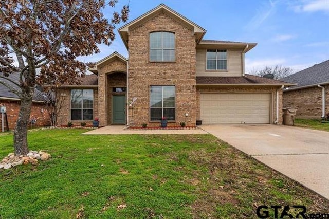 front of property with a garage and a front yard