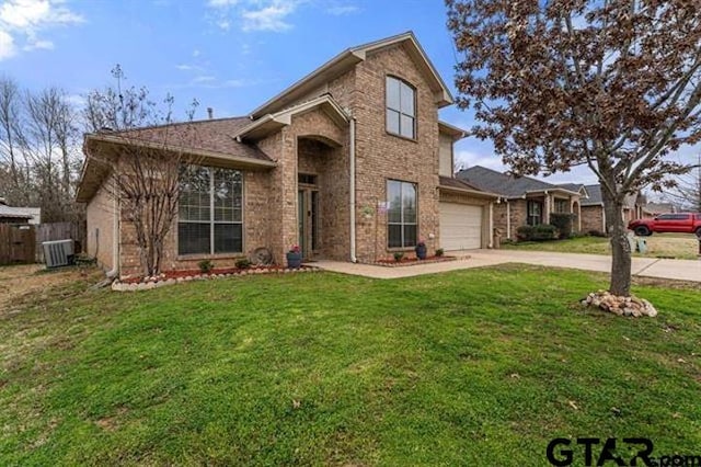 view of front property with cooling unit, a garage, and a front lawn