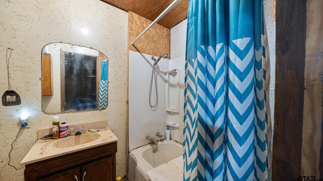 bathroom featuring shower / bath combo and vanity