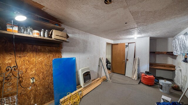 basement featuring heating unit