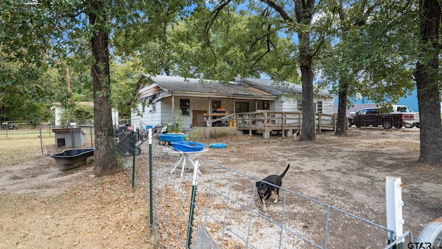 rear view of property with a deck