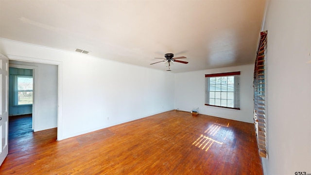 spare room featuring ceiling fan and hardwood / wood-style floors