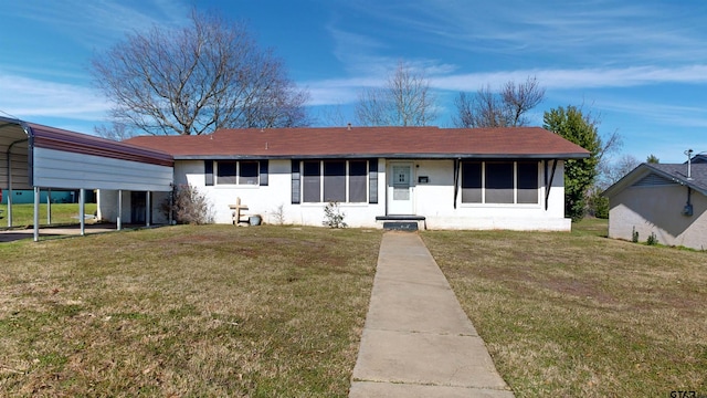 single story home with a carport and a front lawn