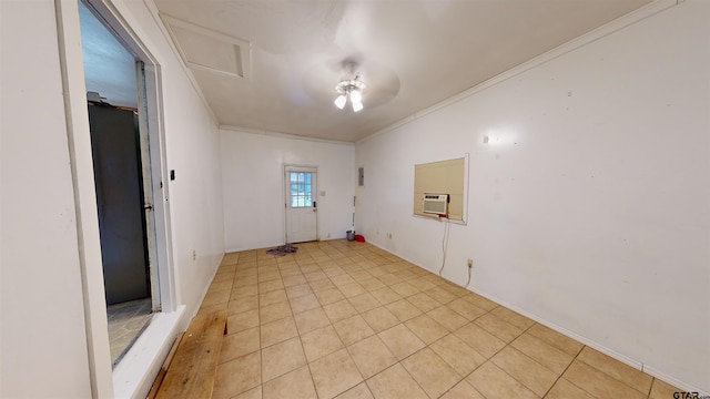 spare room with ceiling fan and crown molding