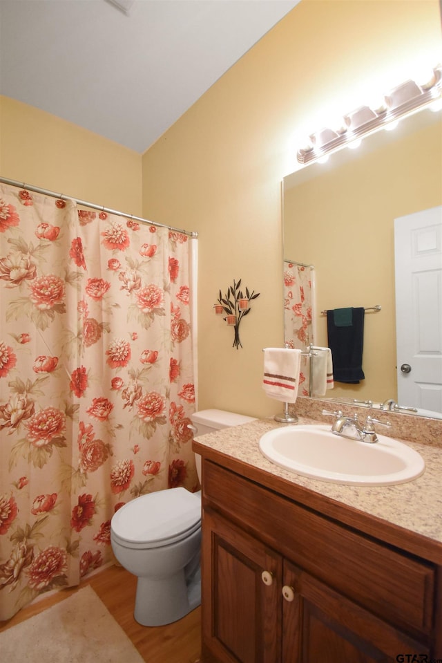 full bath with vanity, wood finished floors, toilet, and a shower with shower curtain