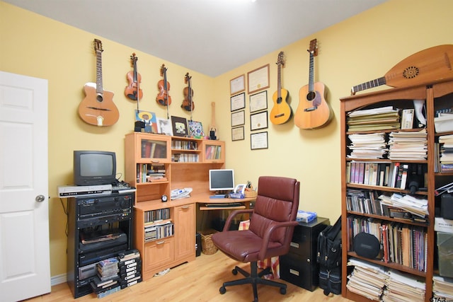 home office with wood finished floors