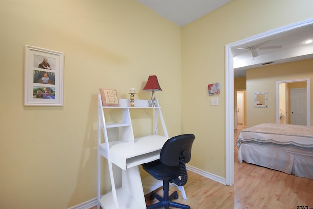 office space with wood finished floors and baseboards