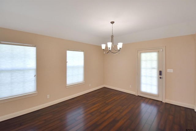413 Maggie Cir, Flint, TX 75762 - unfurnished room featuring dark wood-type flooring and a chandelier