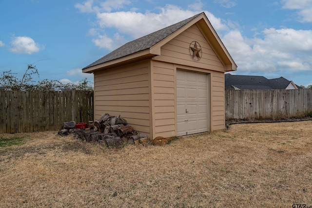 view of outbuilding with a lawn