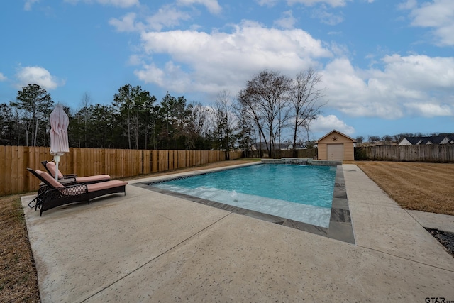 view of pool with a patio, a storage shed, and pool water feature