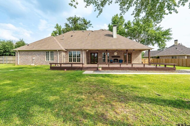 12105 Jazmin Cir, Flint, TX 75762 - rear view of house with a deck, brick siding, a chimney, and a shingled roof