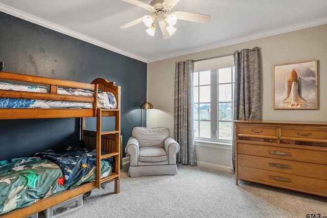 bedroom featuring crown molding, light colored carpet, and ceiling fan