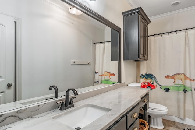 bathroom featuring vanity, crown molding, and toilet