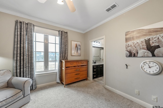 sitting room featuring sink, crown molding, light colored carpet, and ceiling fan