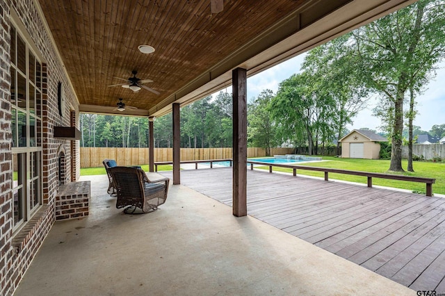12105 Jazmin Cir, Flint, TX 75762 - view of patio with a ceiling fan, an outbuilding, a deck, and a storage shed