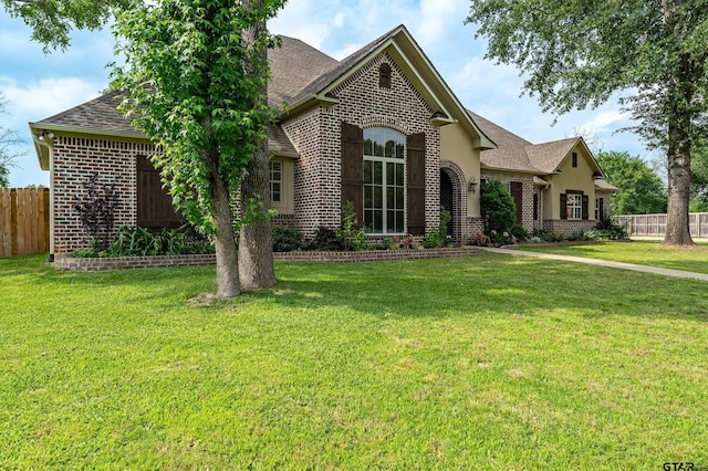 12105 Jazmin Cir, Flint, TX 75762 - french country home featuring brick siding and a shingled roof