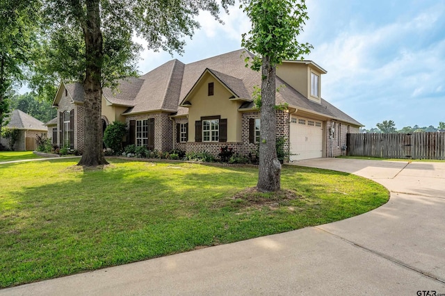 12105 Jazmin Cir, Flint, TX 75762 - traditional-style house featuring stucco siding, driveway, brick siding, and roof with shingles