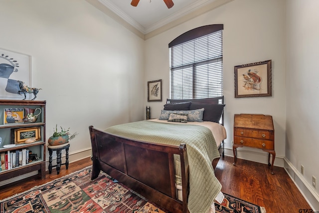 bedroom featuring ornamental molding, dark hardwood / wood-style floors, and ceiling fan