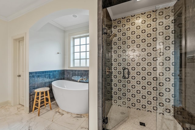 bathroom with ornamental molding, shower with separate bathtub, and tile walls