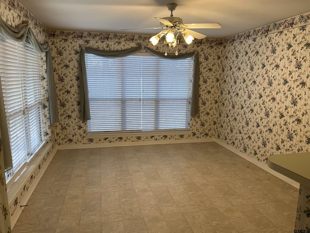 unfurnished room featuring ceiling fan