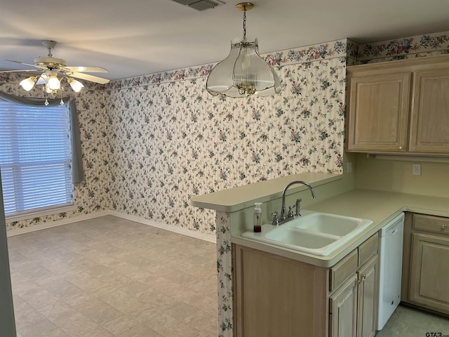 kitchen featuring kitchen peninsula, ceiling fan, decorative light fixtures, dishwasher, and sink