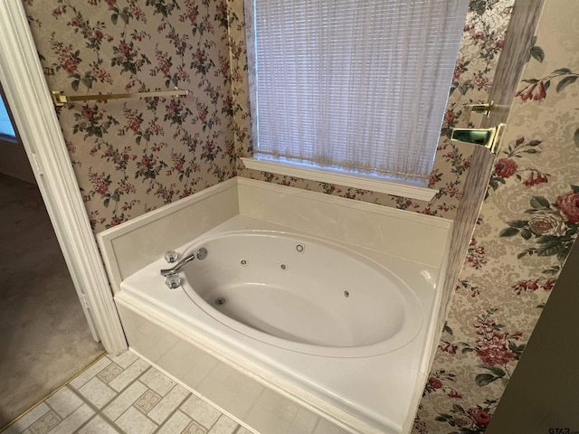 bathroom featuring a bathtub and tile patterned flooring